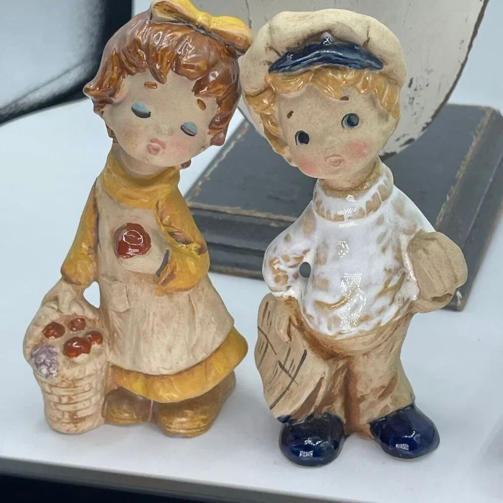 Vintage Lefton ceramic figurines boy newspaper & girl with fruit.